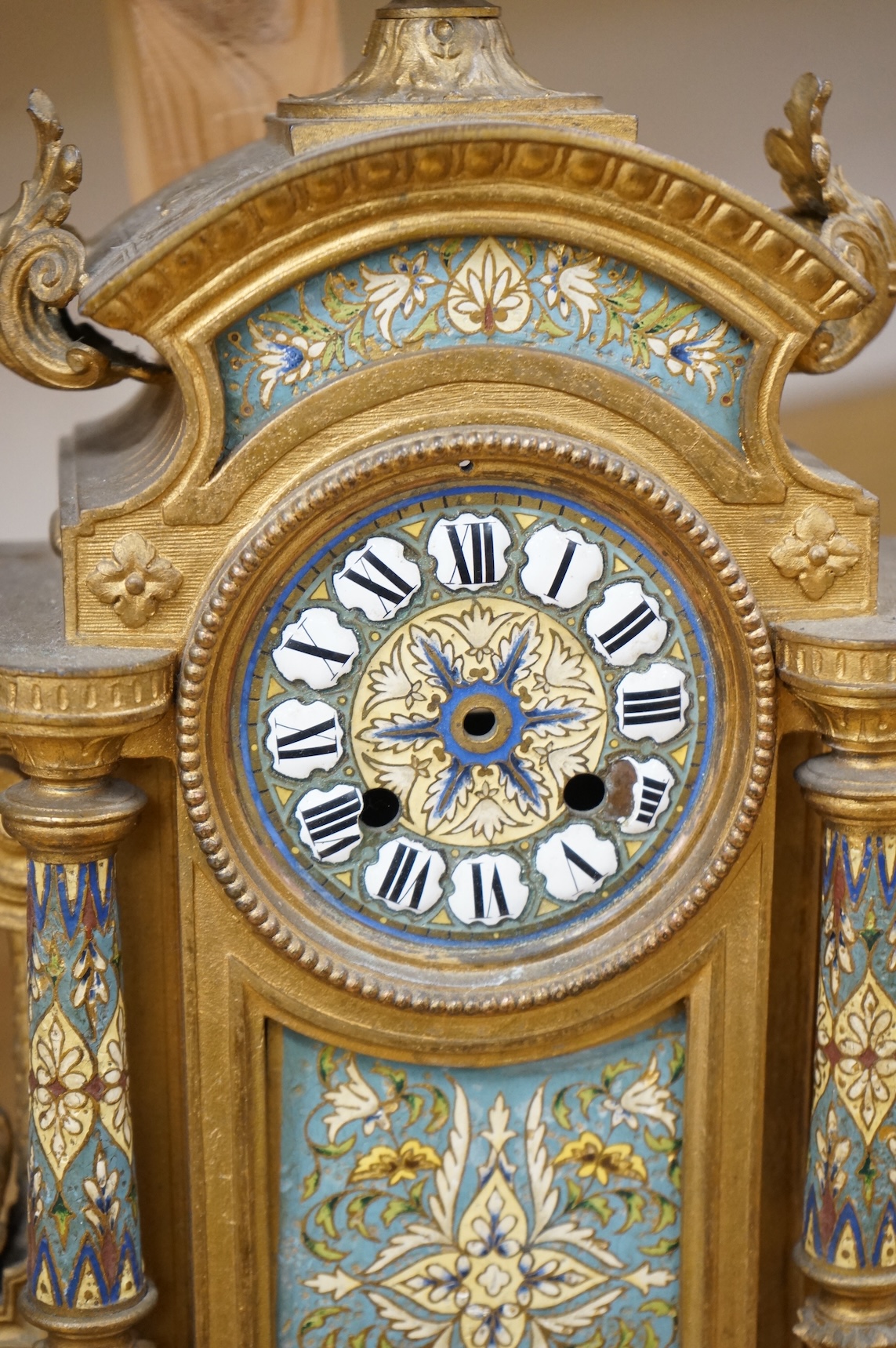A French gilt metal and champleve enamel clock, 41cm